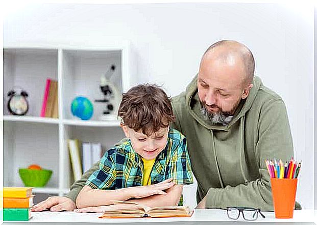 Dad reading with his son