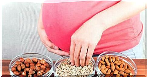 Pregnant woman eating nuts - the mother's microbiome