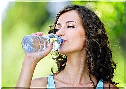 Woman drinking water from a bottle