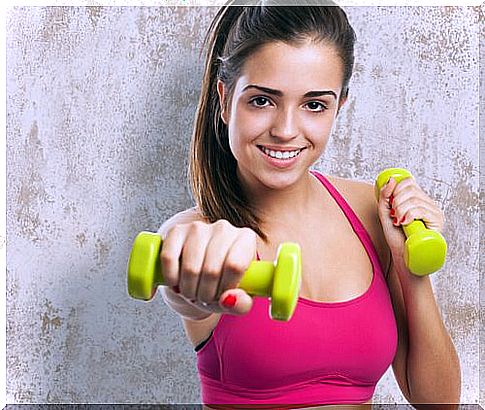 teenage girl with dumbbells