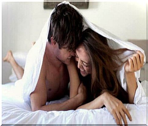 Couple in bed.